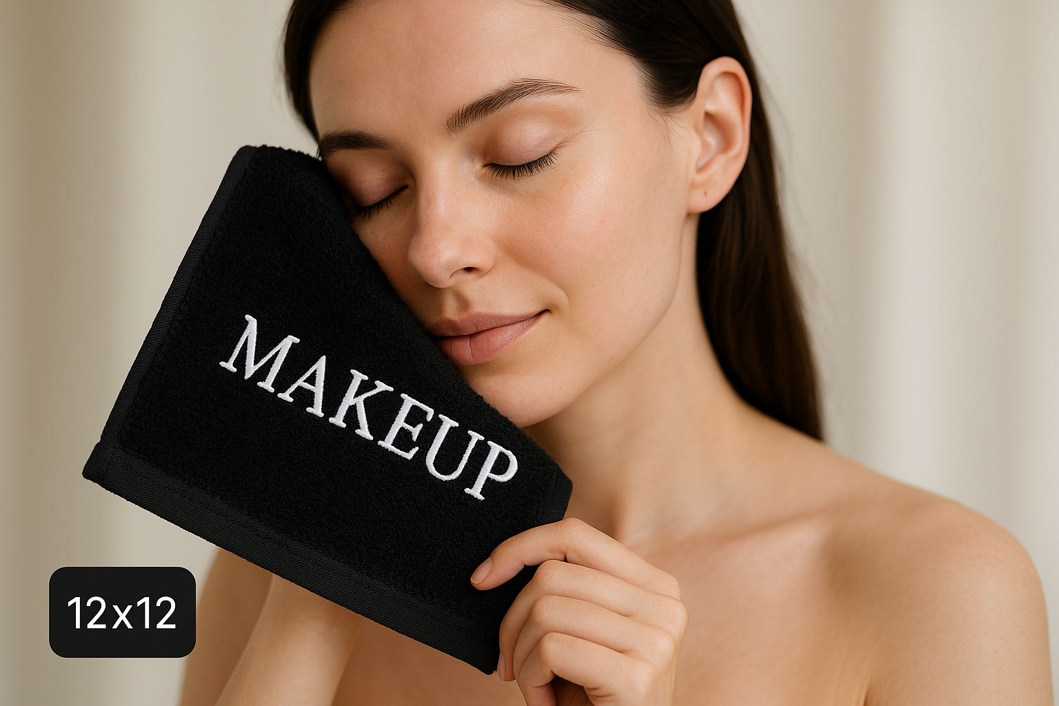 Write MAKEUP in white embroidery on black 12 x 12 towel and girl using it and removing her makeup